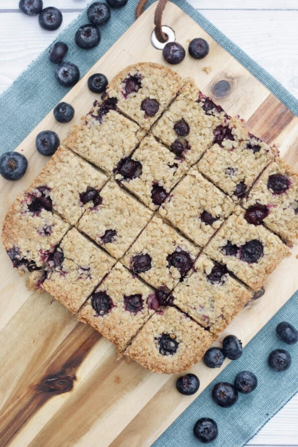 blueberry flapjacks on a wooden board.
