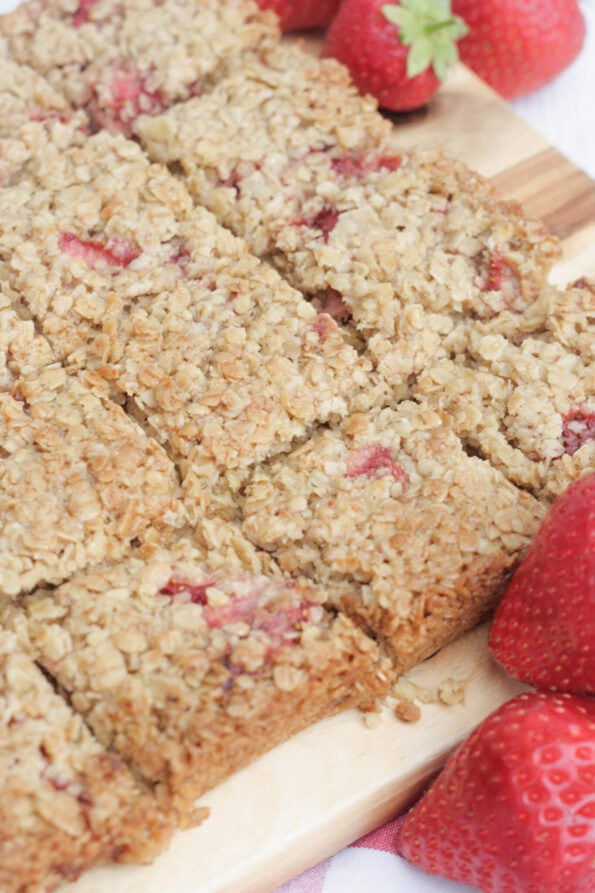 strawberry flapjacks on a wooden board.