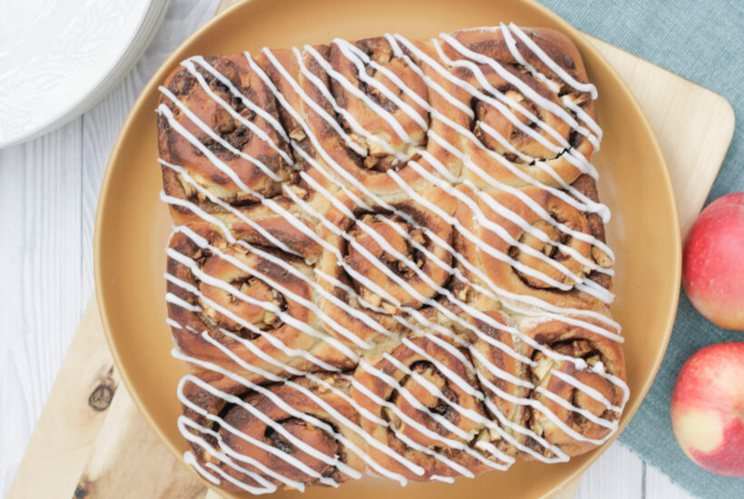apple cinnamon rolls on a serving plate.