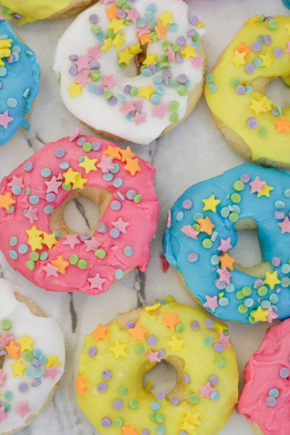 baked doughnuts, iced, on a serving plate.