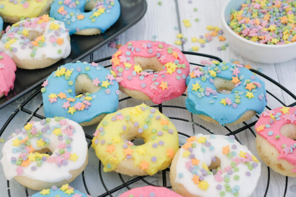 glazed baked doughnuts on a wire rack.